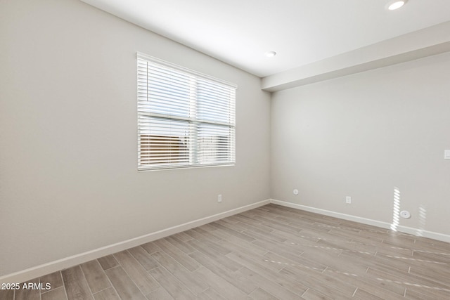 5844 E Covey Ln, Phoenix, AZ 85054 - spare room featuring light wood-style floors, baseboards, and recessed lighting
