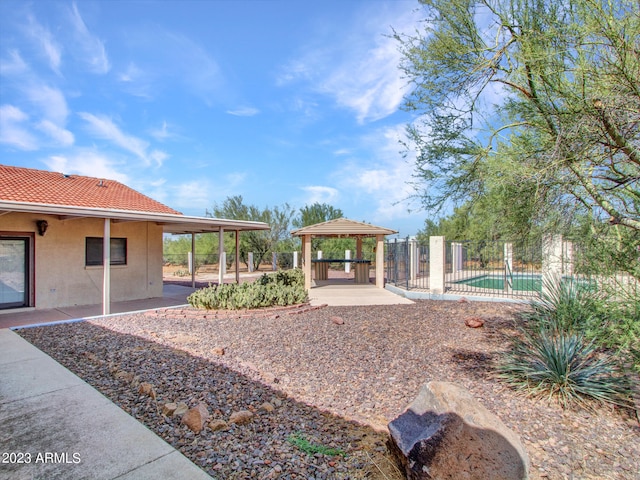 view of nearby features featuring a gazebo, a patio area, and a pool