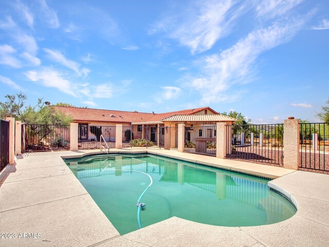 view of pool featuring a patio