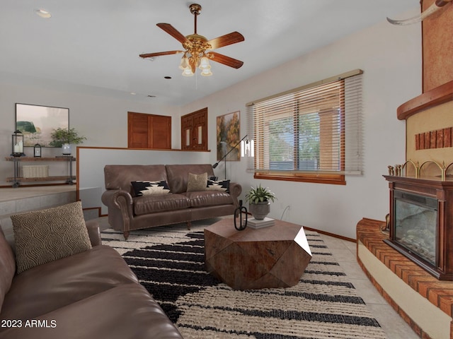 living room featuring ceiling fan and light tile floors