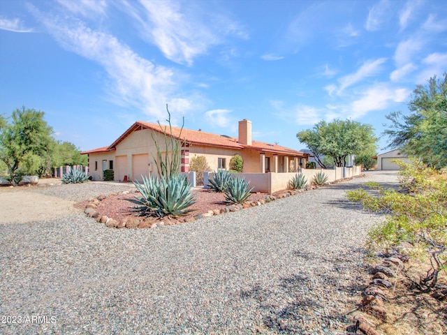 single story home featuring a garage