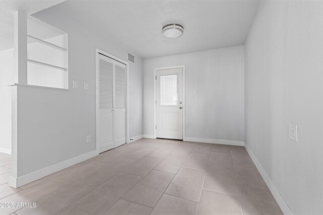 unfurnished bedroom featuring ceiling fan, sink, ensuite bathroom, and hardwood / wood-style flooring