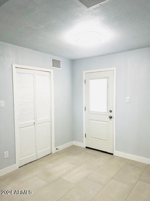 spare room with wood-type flooring and ceiling fan