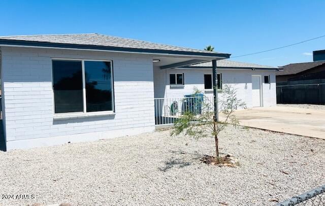 rear view of property featuring a patio