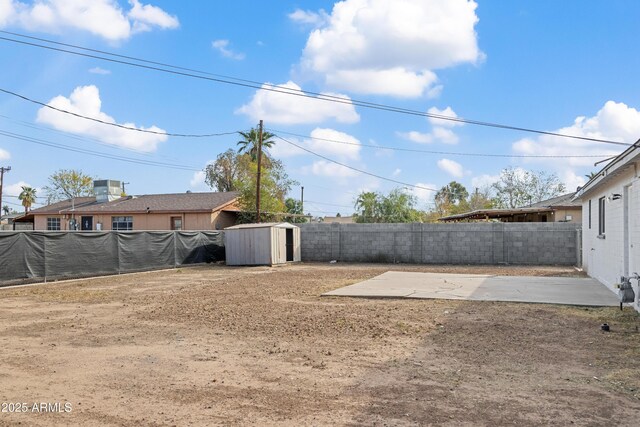 rear view of house with central air condition unit and a patio