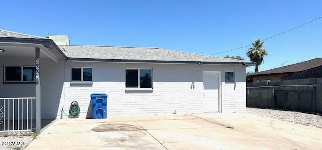 back of property with a patio