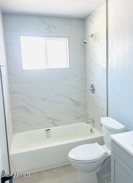 full bathroom with vanity, tiled shower / bath combo, toilet, and tile patterned floors