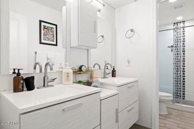 bathroom featuring vanity, curtained shower, wood-type flooring, and toilet