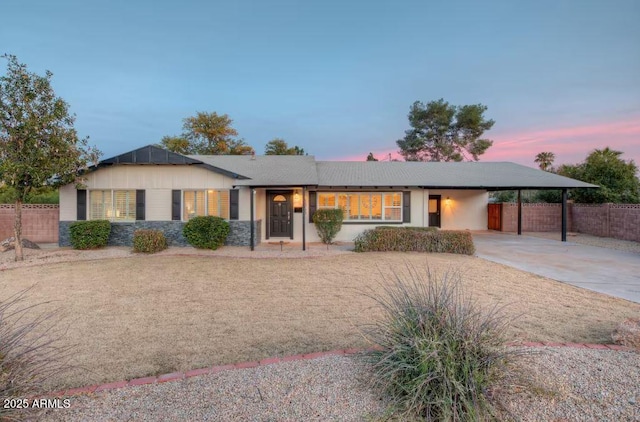 single story home with a carport