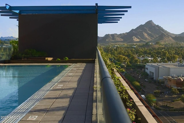 community pool featuring a mountain view