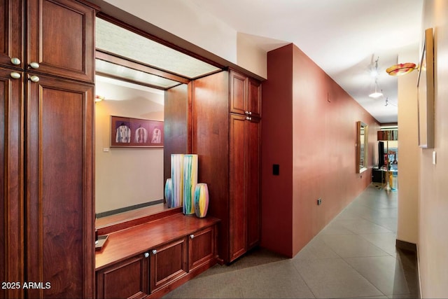 hall featuring tile patterned flooring