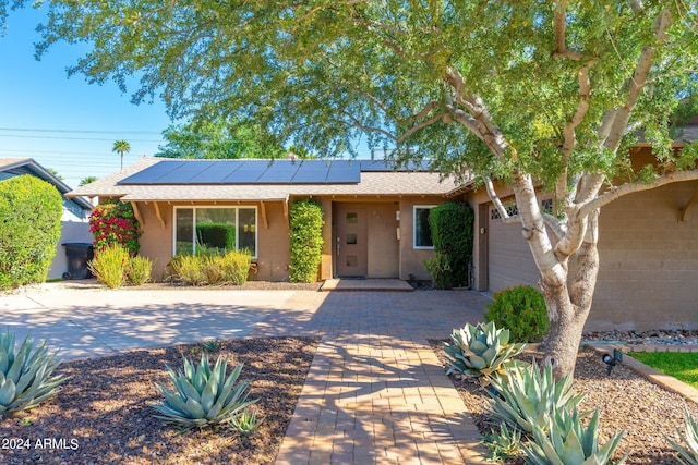 view of front of home with solar panels