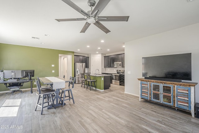 9934 E Orange Grove St, Florence, AZ 85132 - dining room featuring recessed lighting, light wood-type flooring, and a ceiling fan