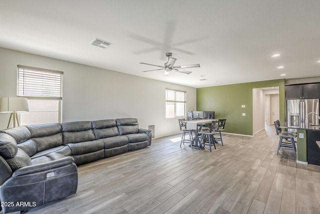 9934 E Orange Grove St, Florence, AZ 85132 - living room with light wood-style floors, a ceiling fan, and recessed lighting
