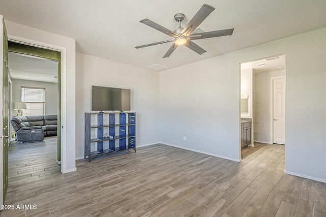 9934 E Orange Grove St, Florence, AZ 85132 - spare room featuring wood finished floors and a ceiling fan