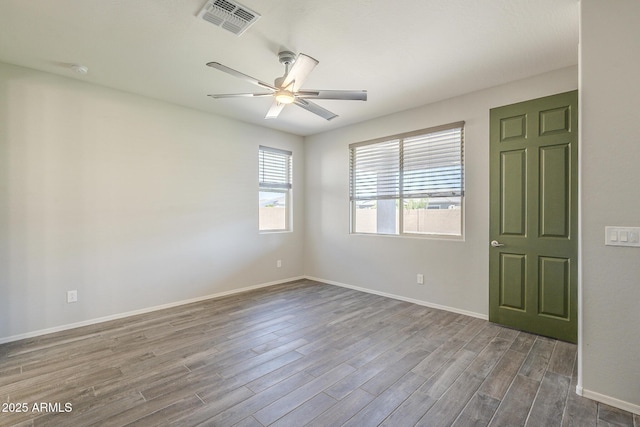 9934 E Orange Grove St, Florence, AZ 85132 - empty room featuring a ceiling fan and dark wood-style floors