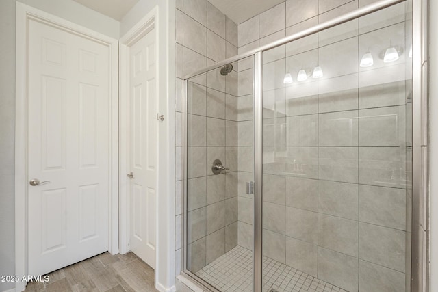9934 E Orange Grove St, Florence, AZ 85132 - bathroom featuring a shower stall and wood finished floors
