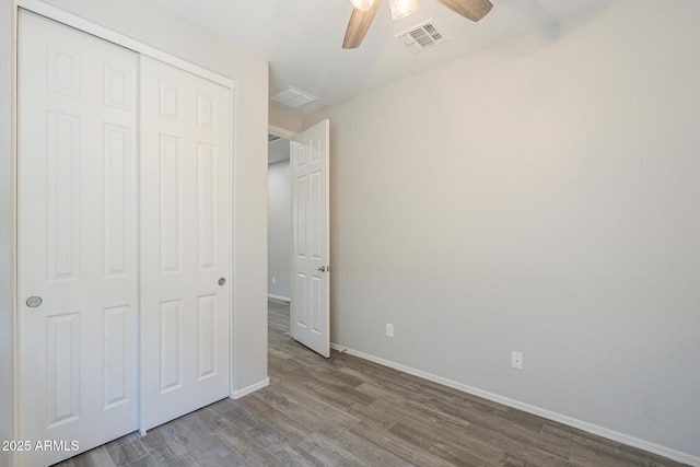 9934 E Orange Grove St, Florence, AZ 85132 - unfurnished bedroom with wood finished floors, a closet, and ceiling fan