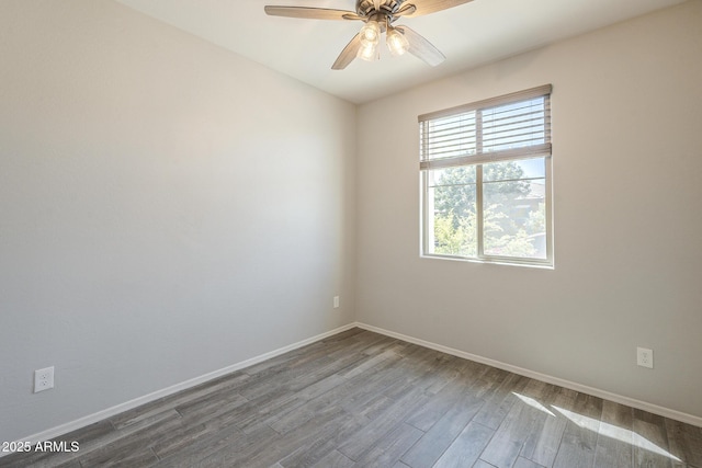 9934 E Orange Grove St, Florence, AZ 85132 - unfurnished room with dark wood finished floors and ceiling fan