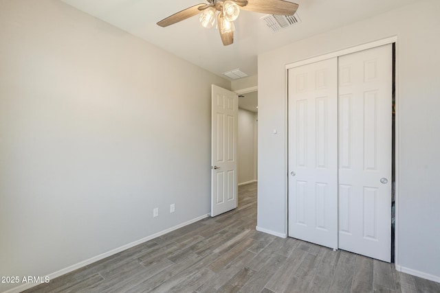 9934 E Orange Grove St, Florence, AZ 85132 - unfurnished bedroom with wood finished floors, a closet, and ceiling fan