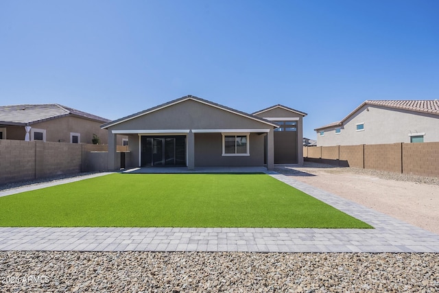 9934 E Orange Grove St, Florence, AZ 85132 - back of property with a fenced backyard and a patio