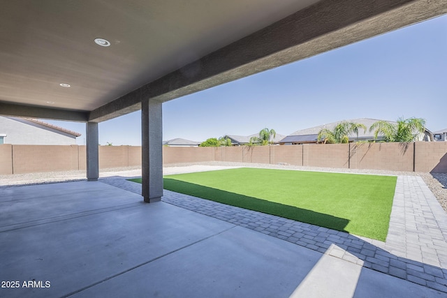 9934 E Orange Grove St, Florence, AZ 85132 - fenced backyard with a patio