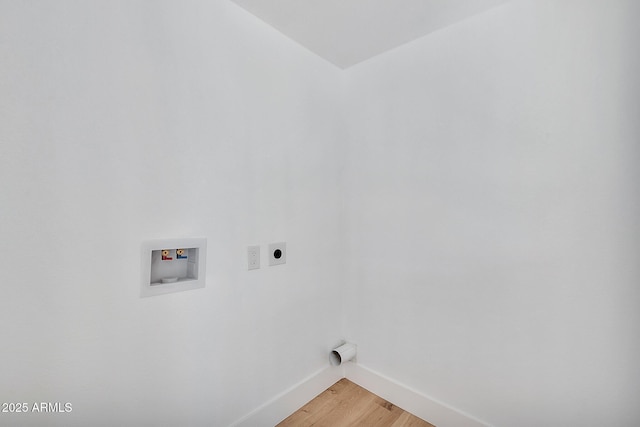 laundry area featuring hookup for an electric dryer, laundry area, washer hookup, baseboards, and light wood finished floors