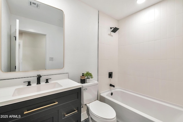 bathroom featuring shower / bath combination, visible vents, vanity, and toilet