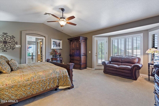 carpeted bedroom featuring access to outside, ceiling fan, a textured ceiling, and vaulted ceiling