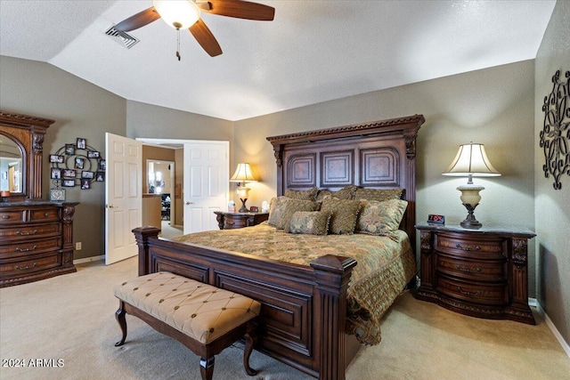 carpeted bedroom with ceiling fan and lofted ceiling