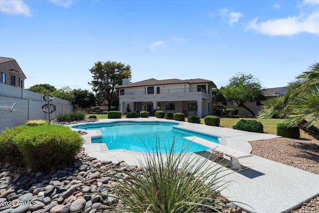 view of pool featuring a diving board and a patio area