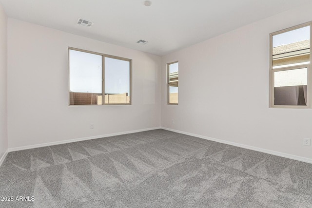 unfurnished room featuring carpet flooring