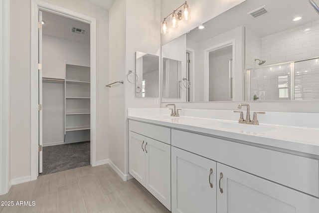 bathroom with vanity and an enclosed shower