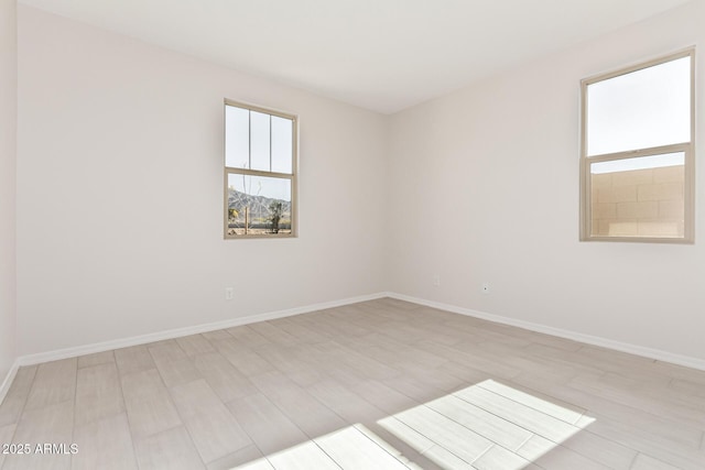 spare room with light wood-type flooring