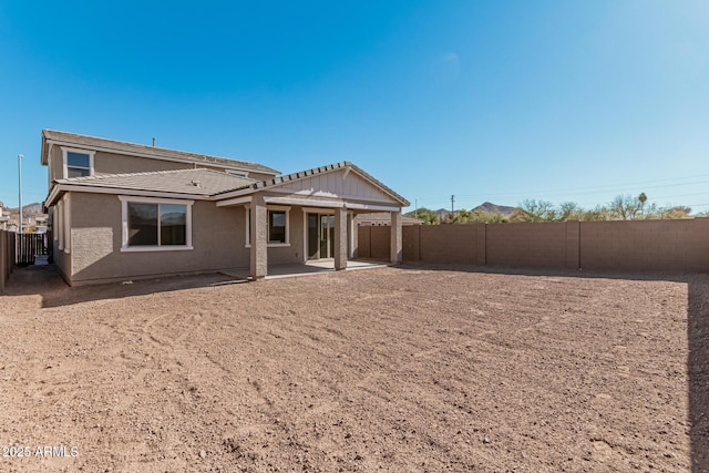 rear view of house with a patio