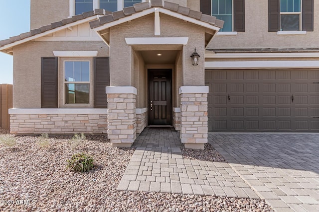 entrance to property featuring a garage