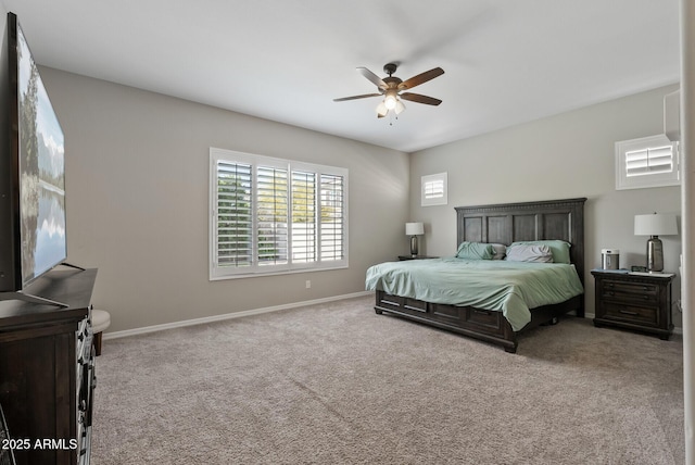bedroom with carpet flooring, a ceiling fan, and baseboards