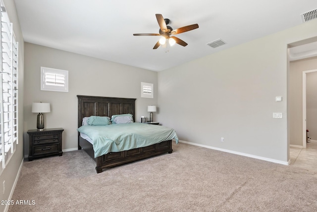 bedroom with carpet floors, baseboards, and visible vents