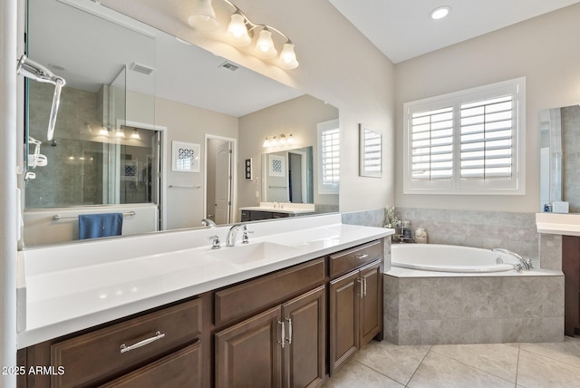 bathroom with tile patterned flooring, a garden tub, visible vents, vanity, and a stall shower