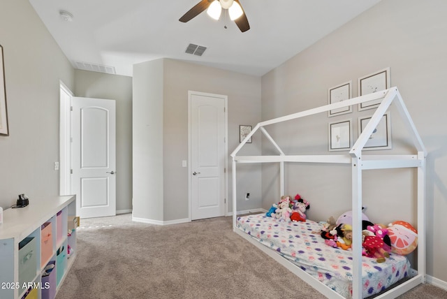 recreation room featuring a ceiling fan, baseboards, visible vents, and carpet