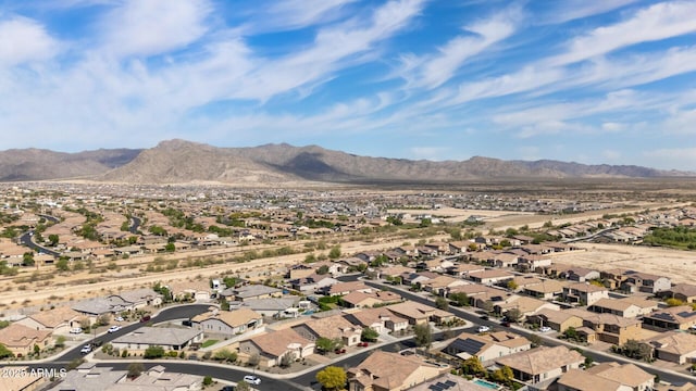 birds eye view of property with a mountain view and a residential view