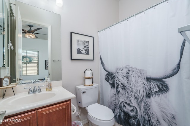 bathroom featuring vanity, ceiling fan, and toilet