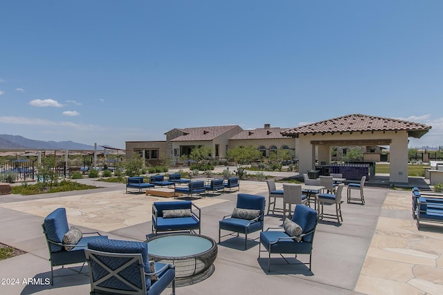 view of patio featuring a gazebo and a mountain view