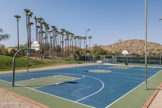 view of basketball court with a mountain view