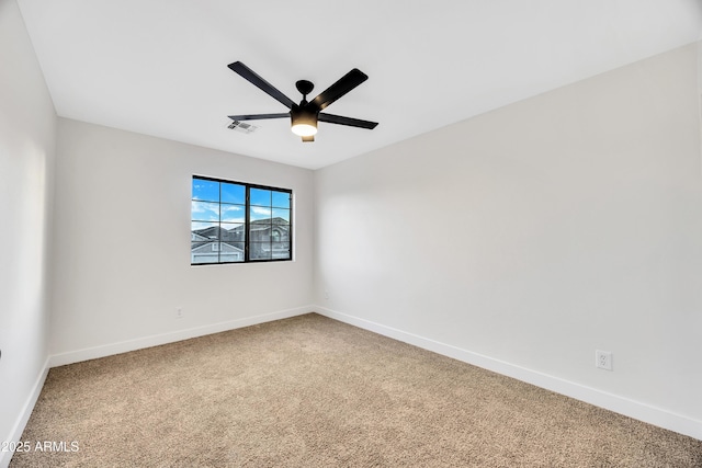 empty room with carpet floors and ceiling fan