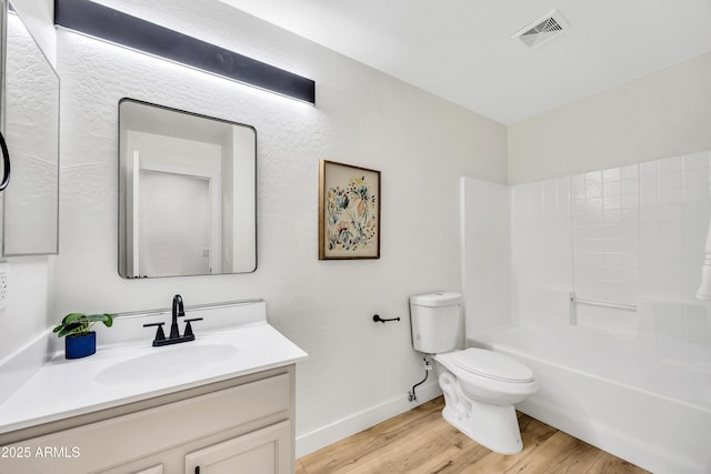 full bathroom featuring hardwood / wood-style flooring, vanity, shower / bathing tub combination, and toilet