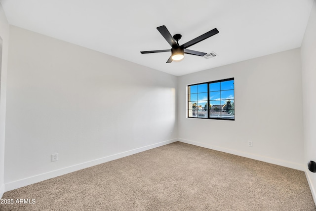 empty room featuring ceiling fan and carpet flooring