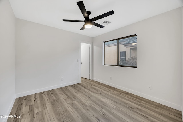 unfurnished room with ceiling fan and light wood-type flooring