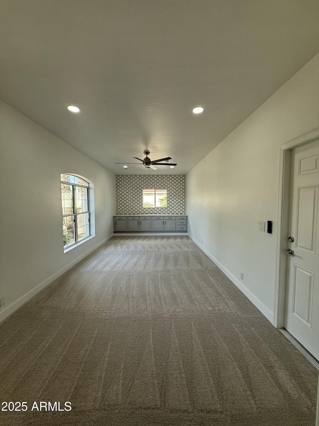 unfurnished room with ceiling fan, recessed lighting, and carpet