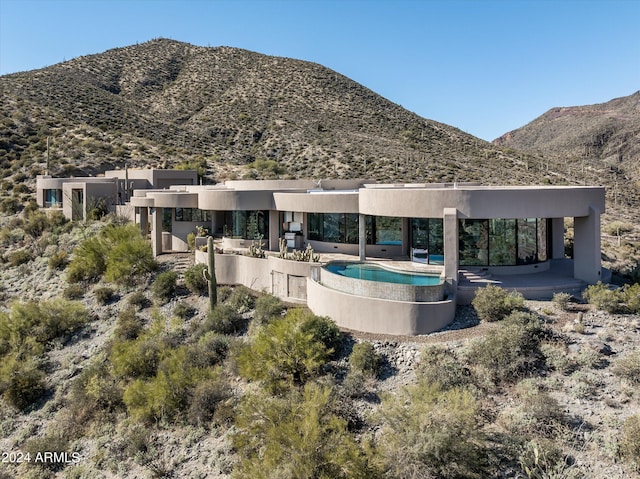 8877 E Charolais Dr, Scottsdale, AZ 85262 - rear view of house with a mountain view